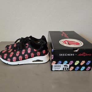 the Rolling Stones Black Sneakers with Red Tongue Pattern